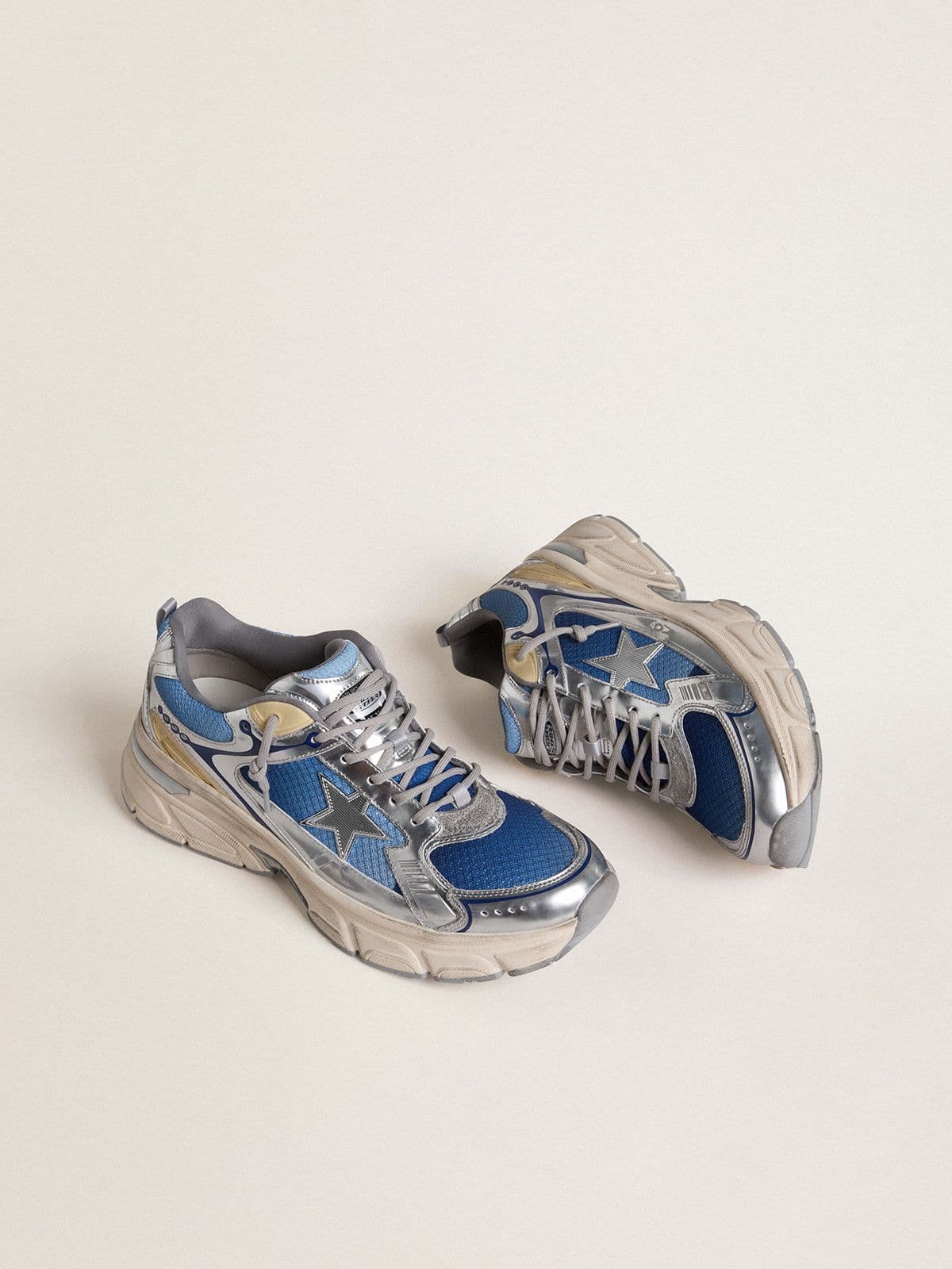 Golden Goose Women's Lightstar  in light blue mesh with white TPU star and silver bio-based inserts