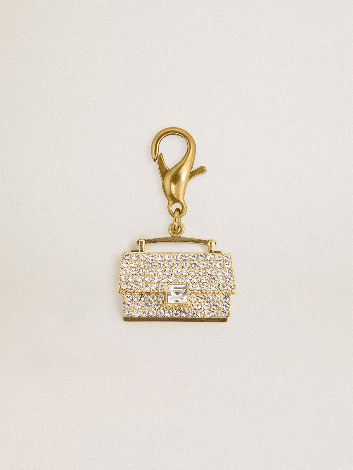 Golden Goose Purse-shaped charm in gold-colored brass with crystals