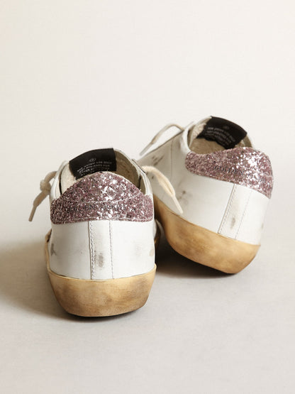 Golden Goose Super-Star with a tan star and pink glitter heel tab