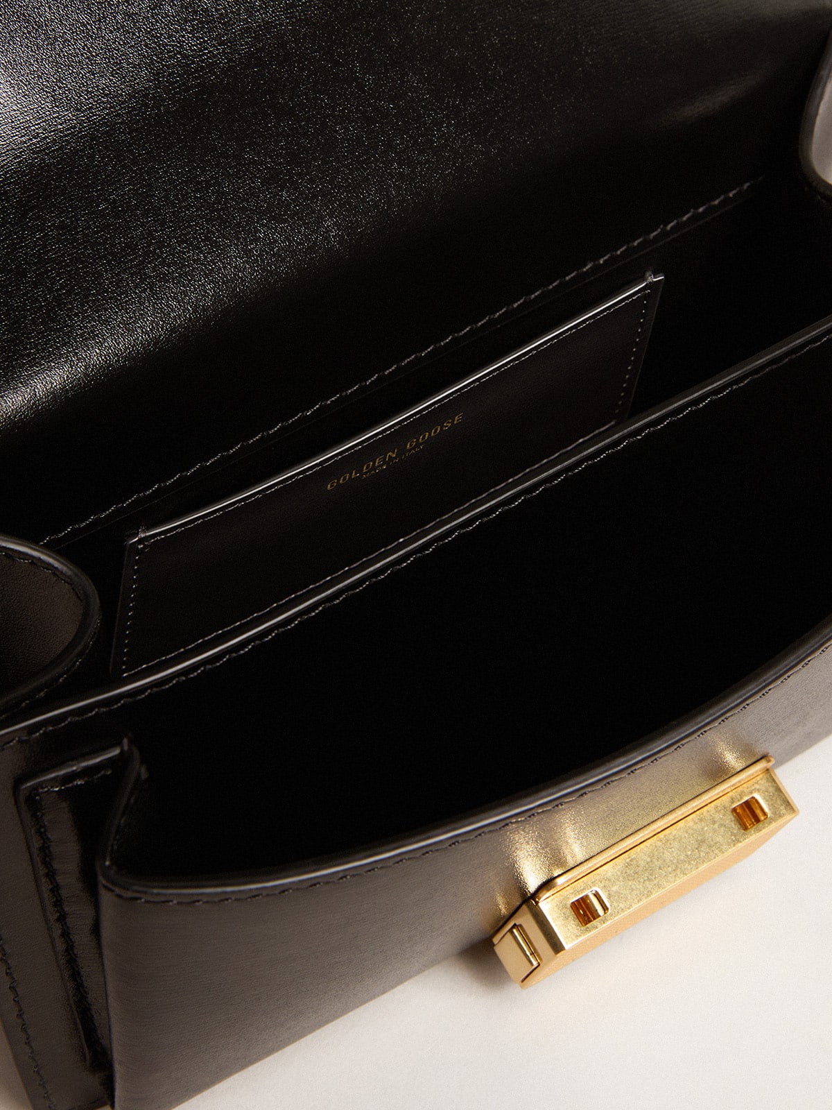 Golden Goose Small Venezia Bag in black boarded leather with gold details