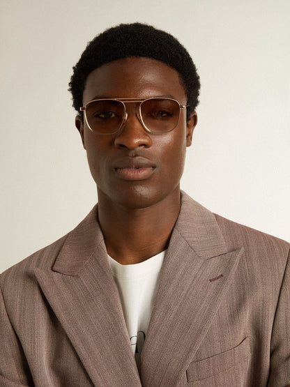 Golden Goose Aviator-style sunglasses with gold frame and beige lenses