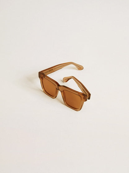 Golden Goose Jamie style square sunglasses with honey-colored frame and lenses