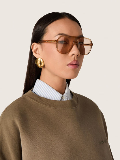 Golden Goose Aviator style sunglasses with honey-colored frame and lenses