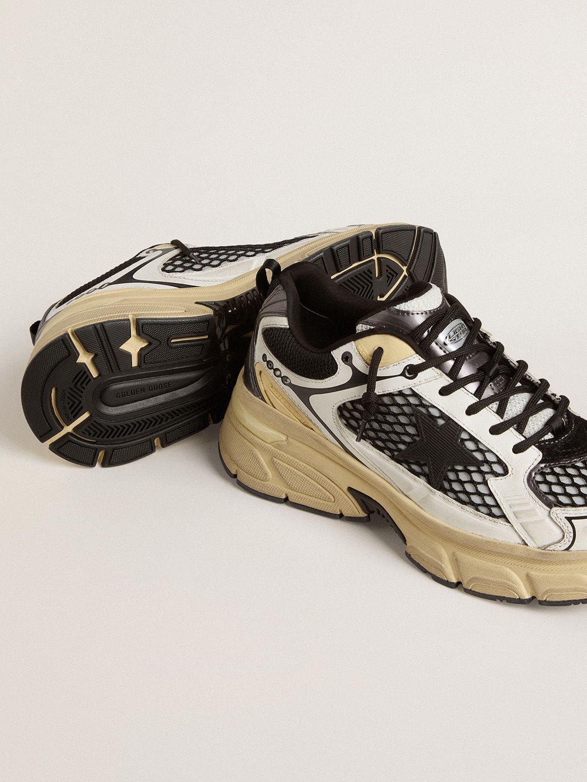 Golden Goose Men’s Lightstar in white leather and black mesh with black TPU star