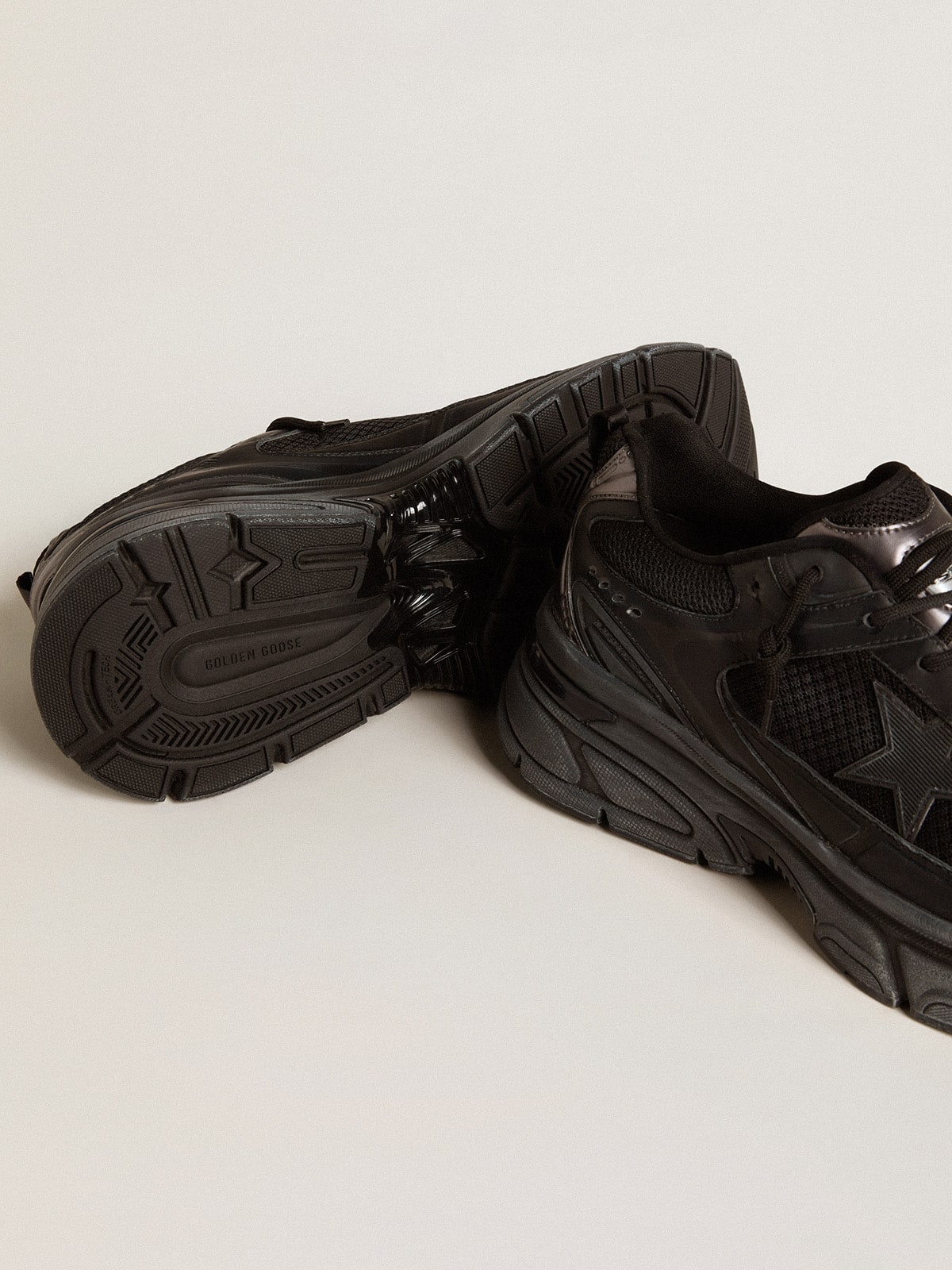 Golden Goose Men’s Lightstar with black leather and mesh upper and black star