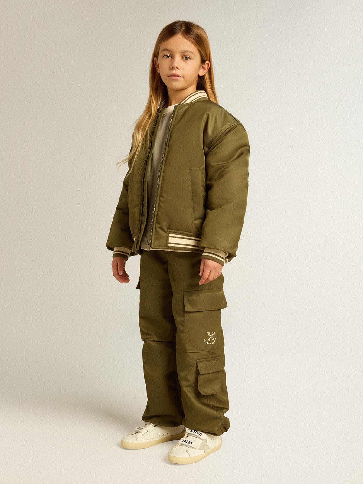 Golden Goose Kids military-green nylon bomber jacket with lettering on the back