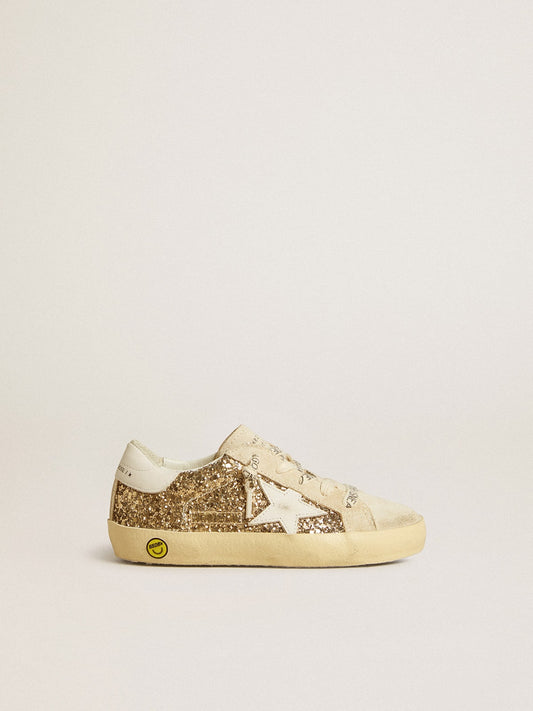 Golden Goose Super-Star Junior in gold glitter with white leather star and heel tab