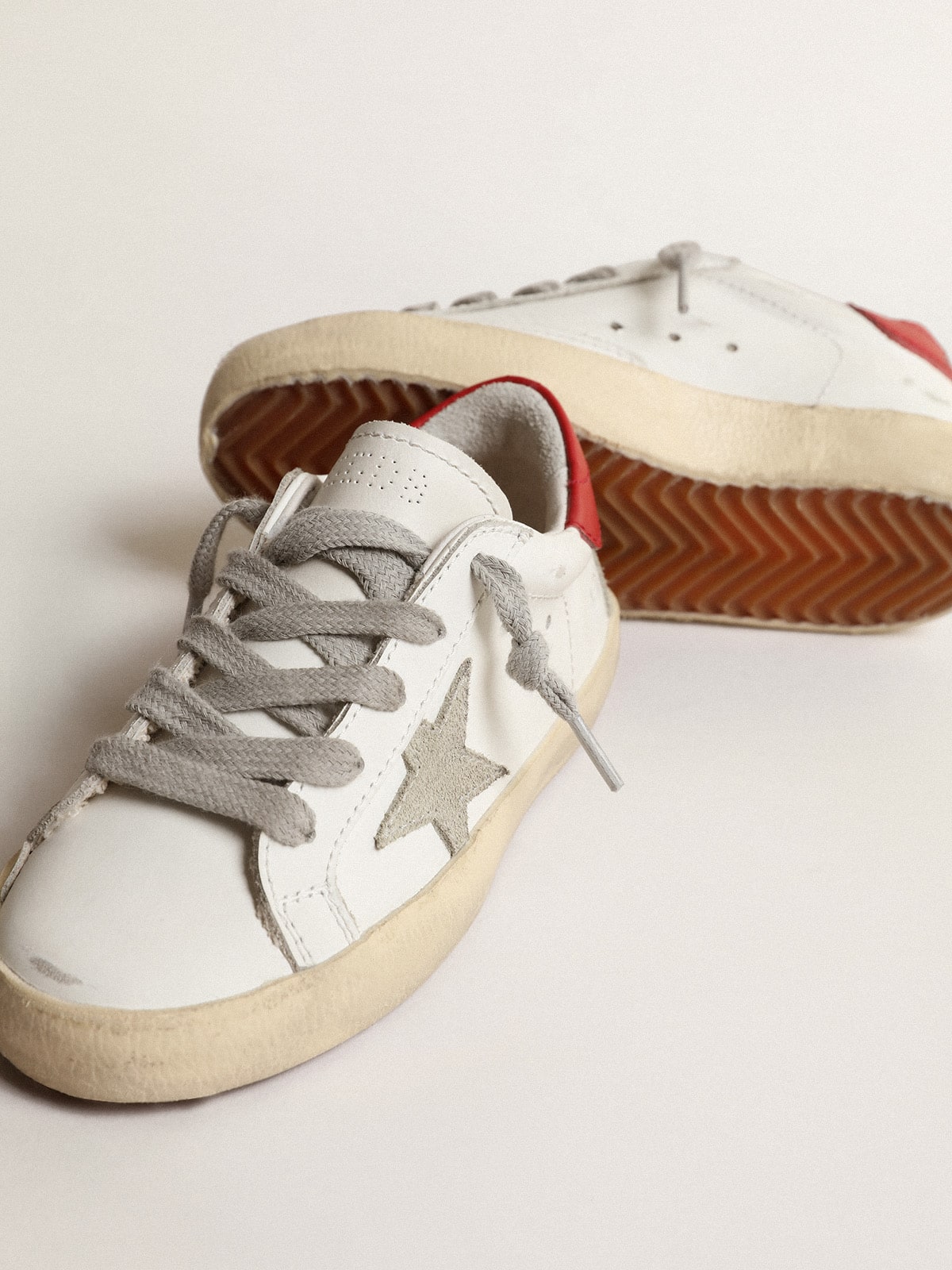 Golden Goose Super-Star Young with suede star and red leather heel tab